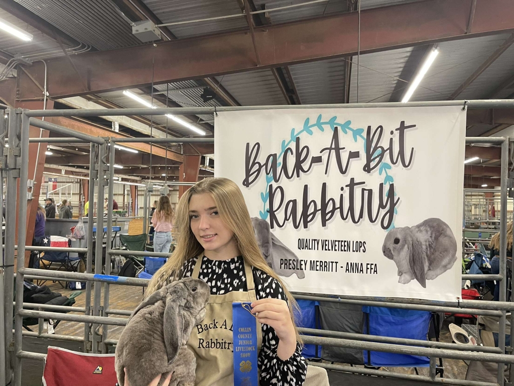 Presley Merritt supports her business while competing at the Collin County Livestock Show.