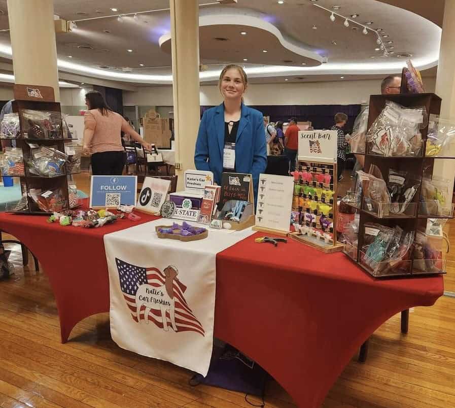 Katie Aubert displays her business and SAE, Katie’s Car Freshies, at a trade show in Kansas.