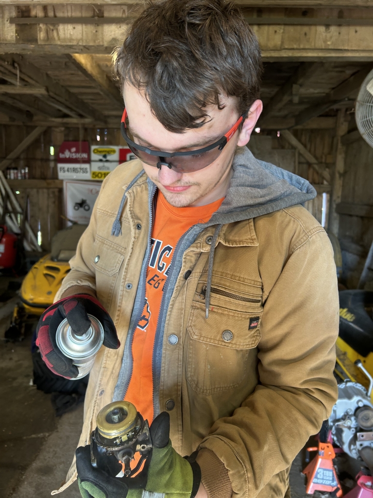 Andrew Curtis Szalach works in his shop.