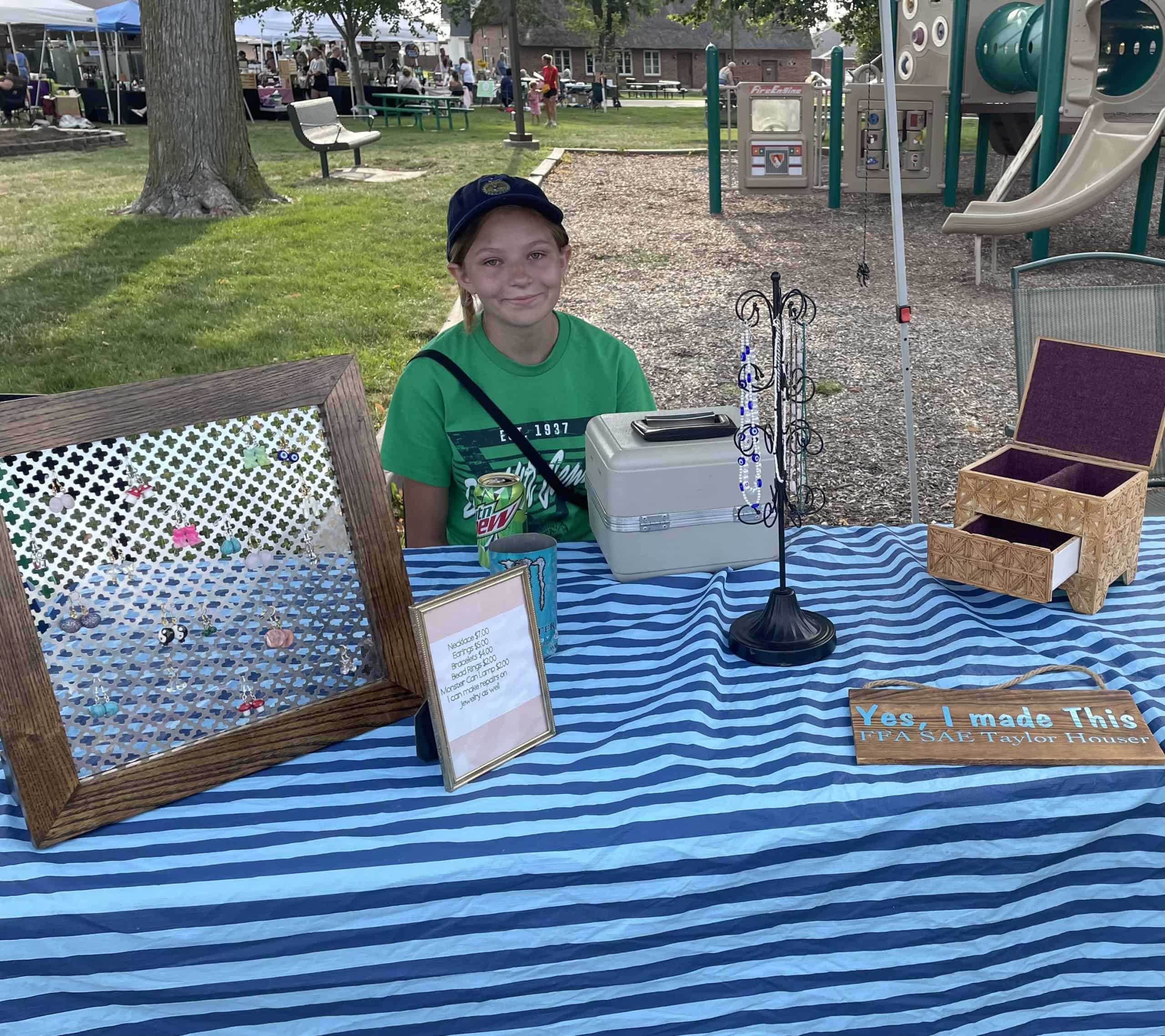 DeWitt Central FFA Member Taylor Houser sells her jewelry at the DeWitt Farmers Market.