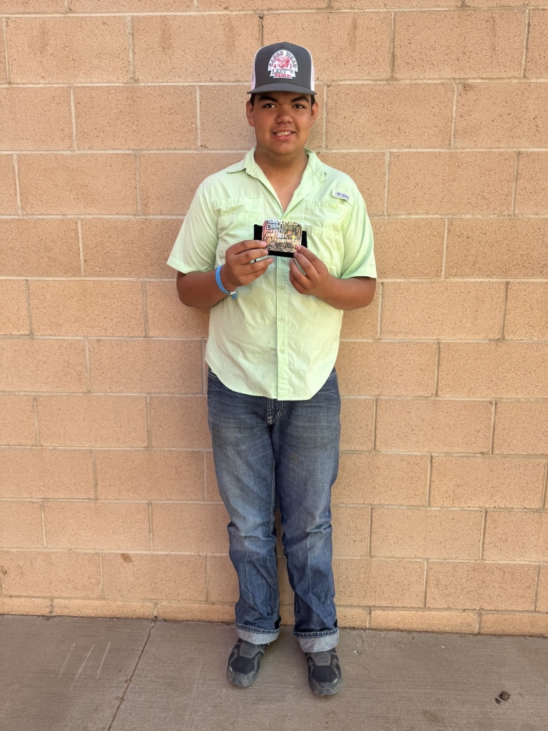 Corral won a herdsmanship buckle in the goat barn at his county fair, showcasing his hard work and dedication.