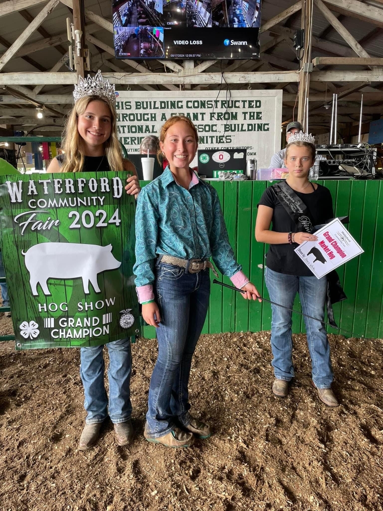 Alexis White poses with Washington County fair royalty after winning grand champion.