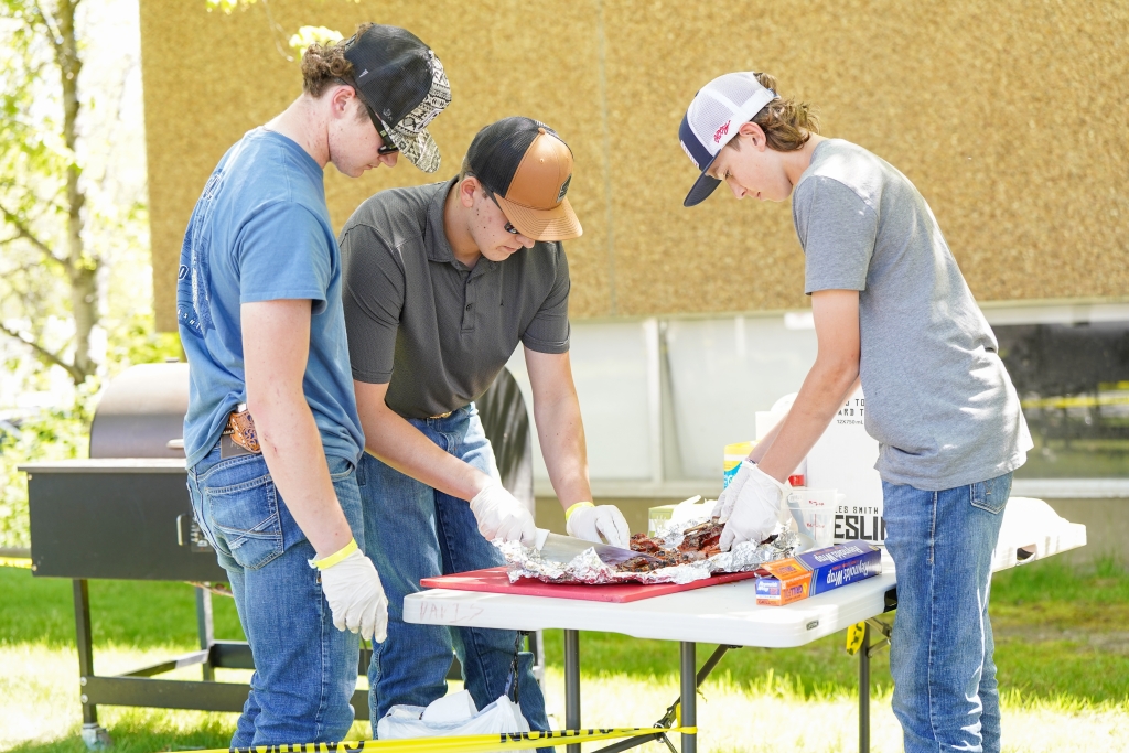 Washington FFA members prepare a rack of ribs. Photo courtesy of the Washington FFA Association.