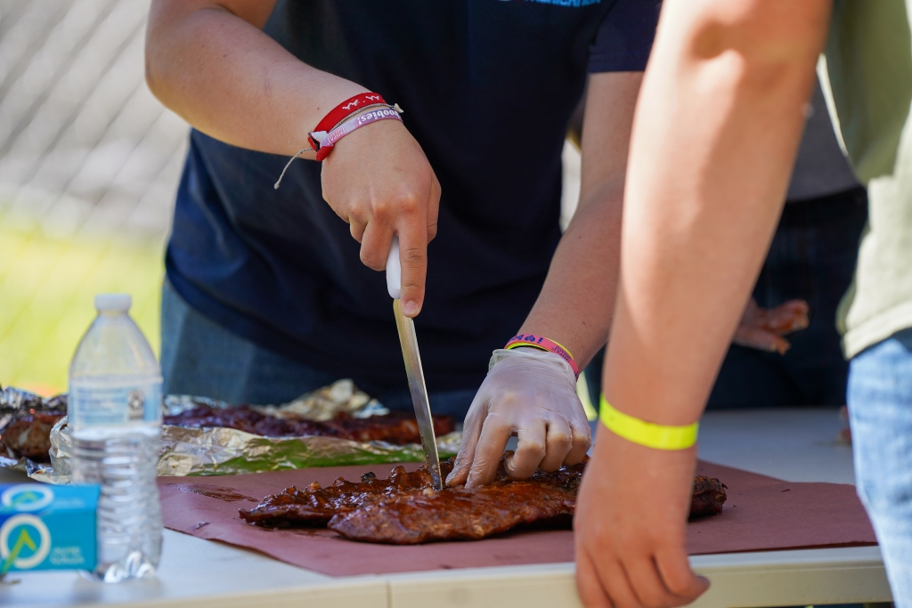 A Washington FFA member prepares ribs for judges during the state barbecue competition. Photo courtesy of the Washington FFA Association.