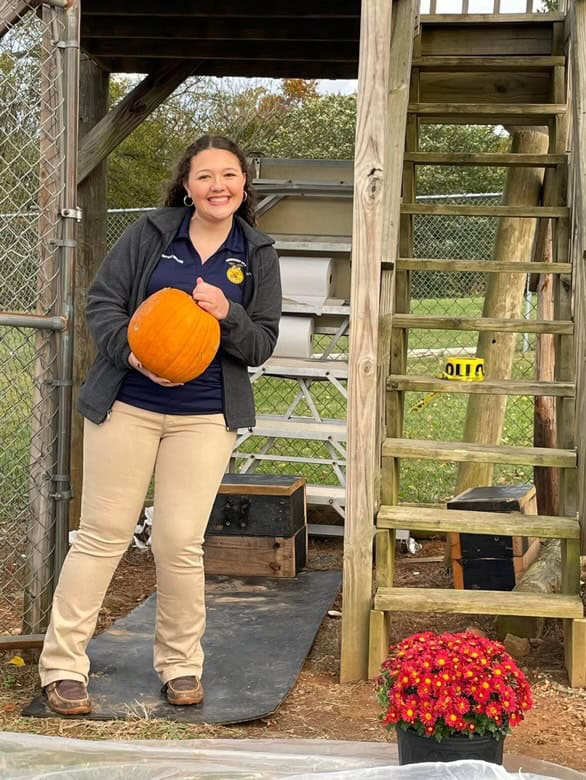 Pulaski County FFA member gathers pumpkins at the tower to get smashed.