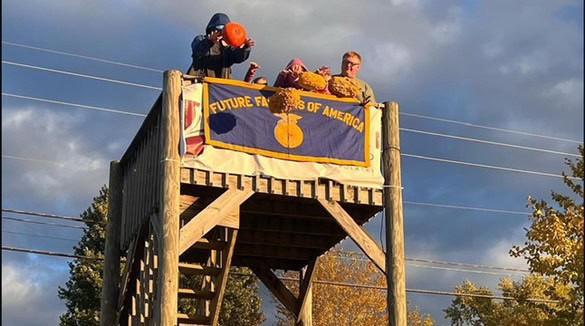 Clinton Corner in action, preparing to smash pumpkins.