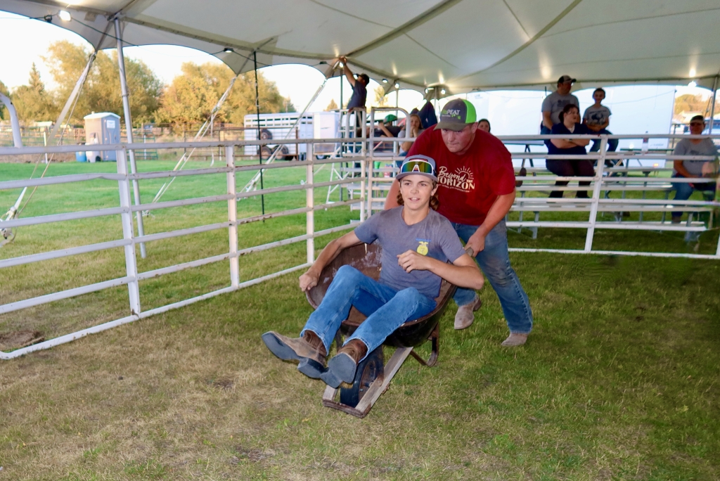 Sugar-Salem FFA member Brandon Little pushes Max Banta to the finish line.