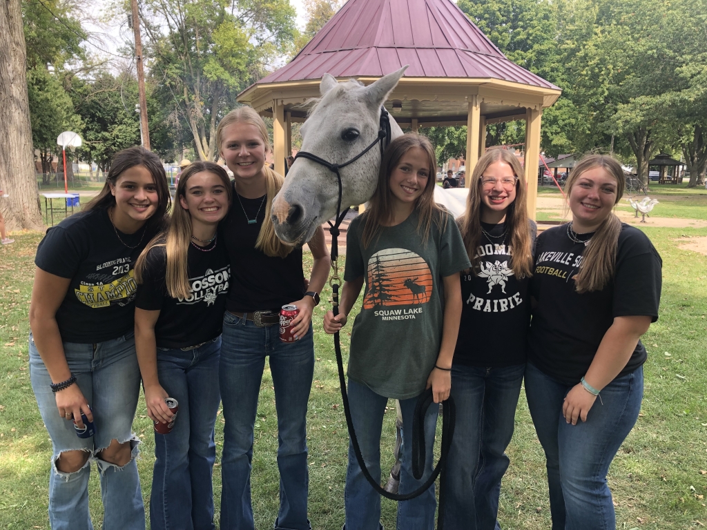 Chapter members pose with one of the horses they brought to the event.