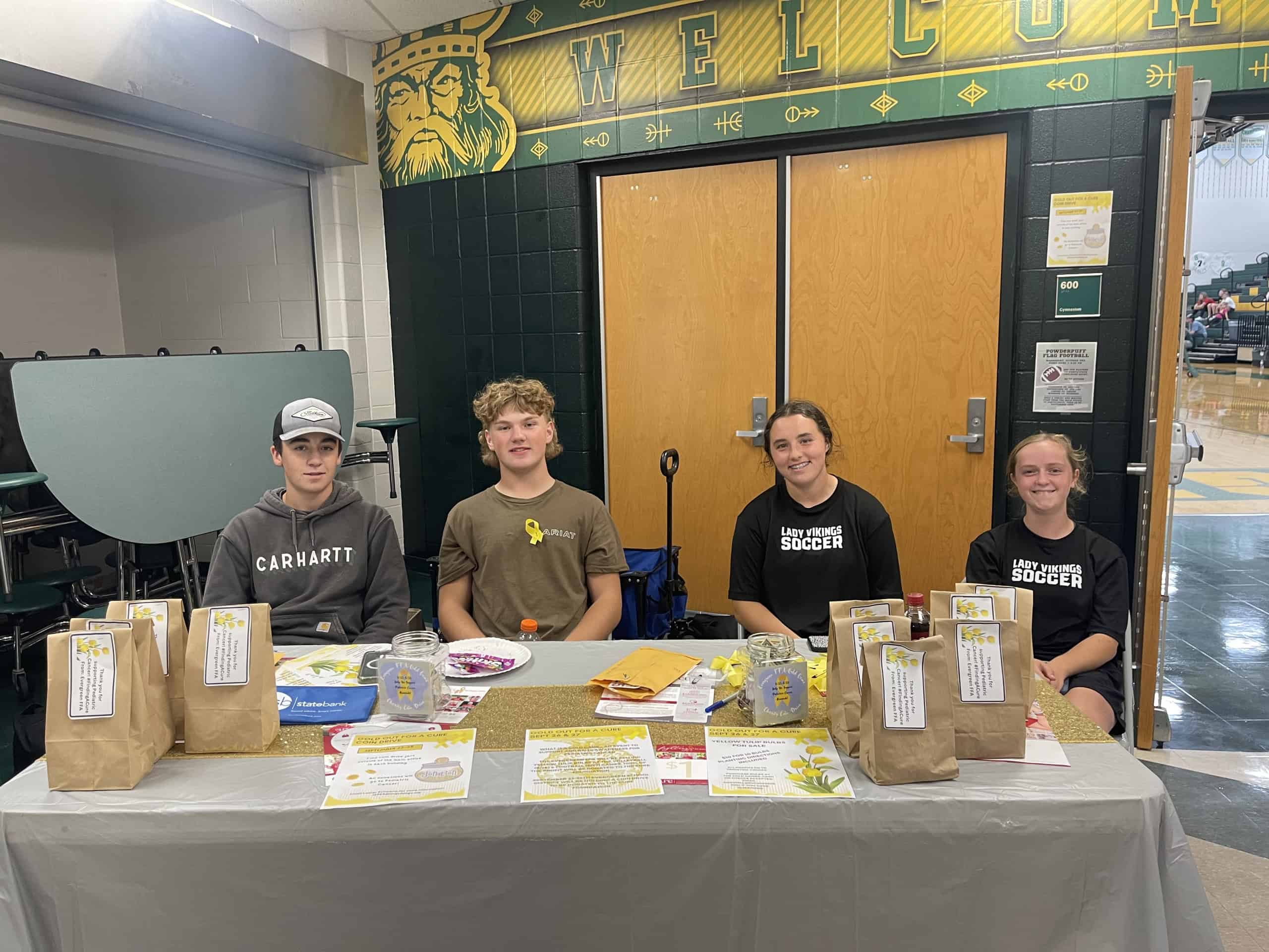 Evergreen FFA members volunteered to help collect donations at the volleyball game.