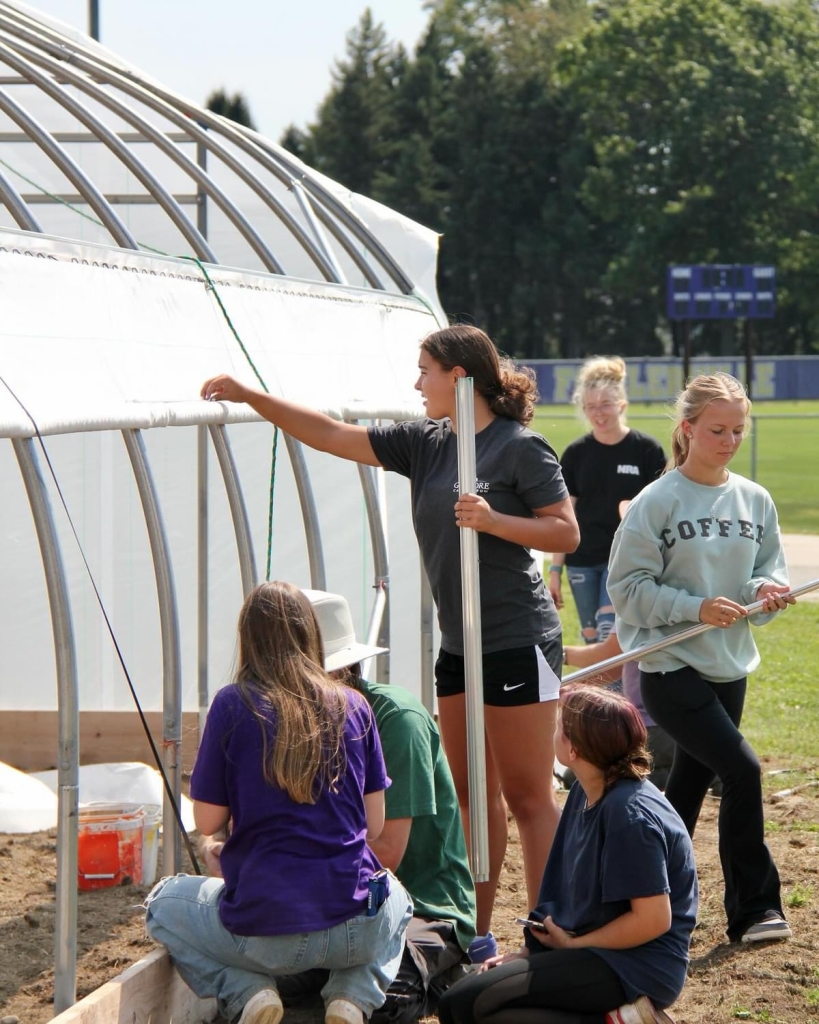 Members working on the greenhouse.