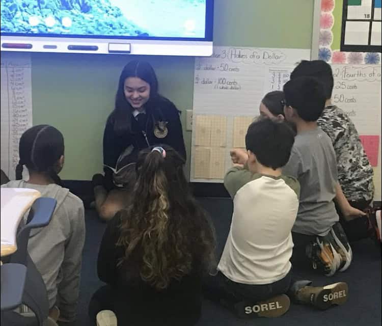 Odessa FFA member Giada Mancuso reads to a first grade class.