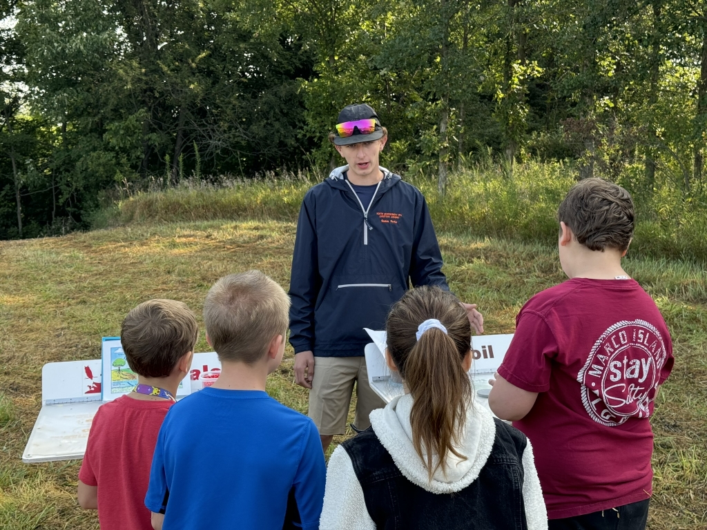 North Montgomery FFA member Kaden Parks guides students through the water cycle.