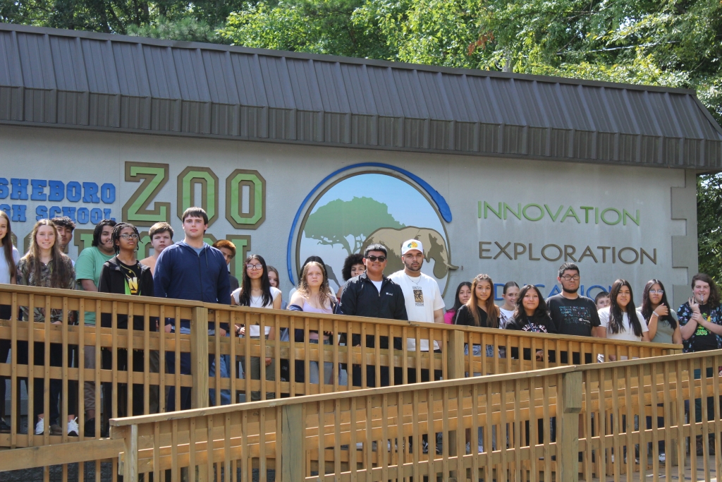 Zoo School students standing outside their agriculture classrooms.