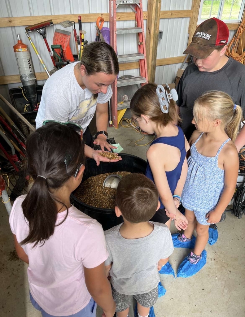 Ava Susong teaches campers about animal feed.