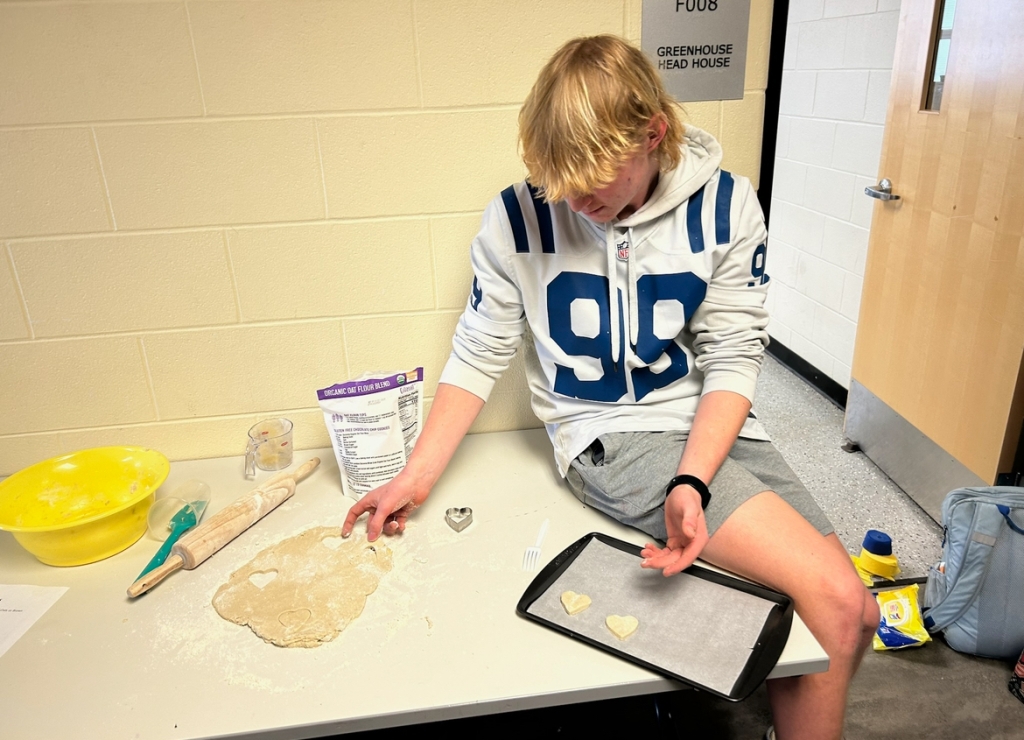 Lebanon FFA member Owen Bigler preps dogs treats to go into the oven.