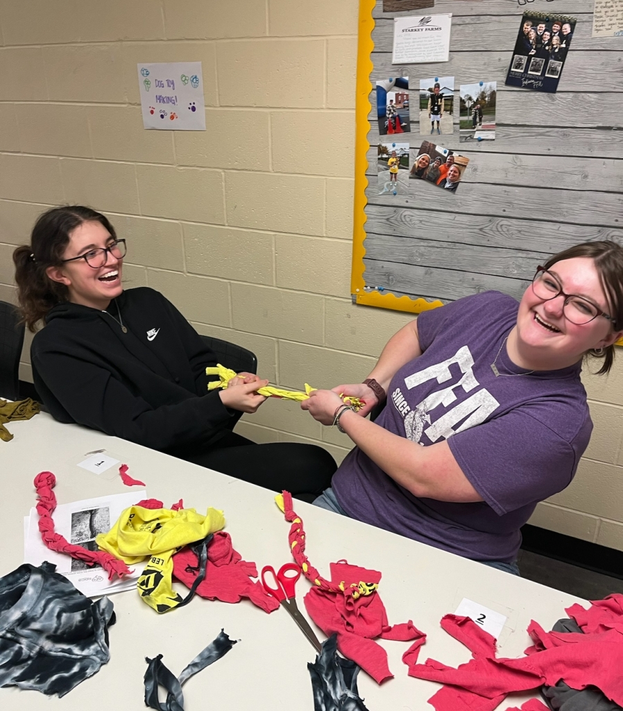 Lebanon FFA members Lauren Argotte and Kira King work together to make dog toys.