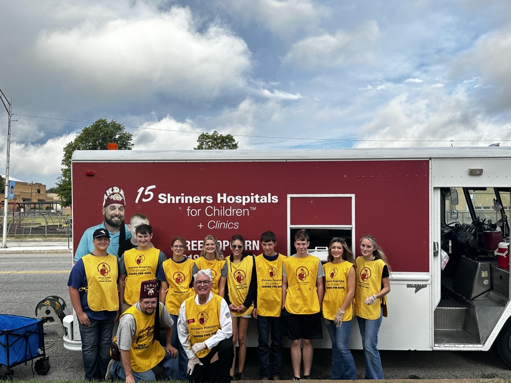 Depew FFA members assist the Shriners at the 62nd Bristow Western Heritage Day Parade by handing out and bagging popcorn for parade-goers.