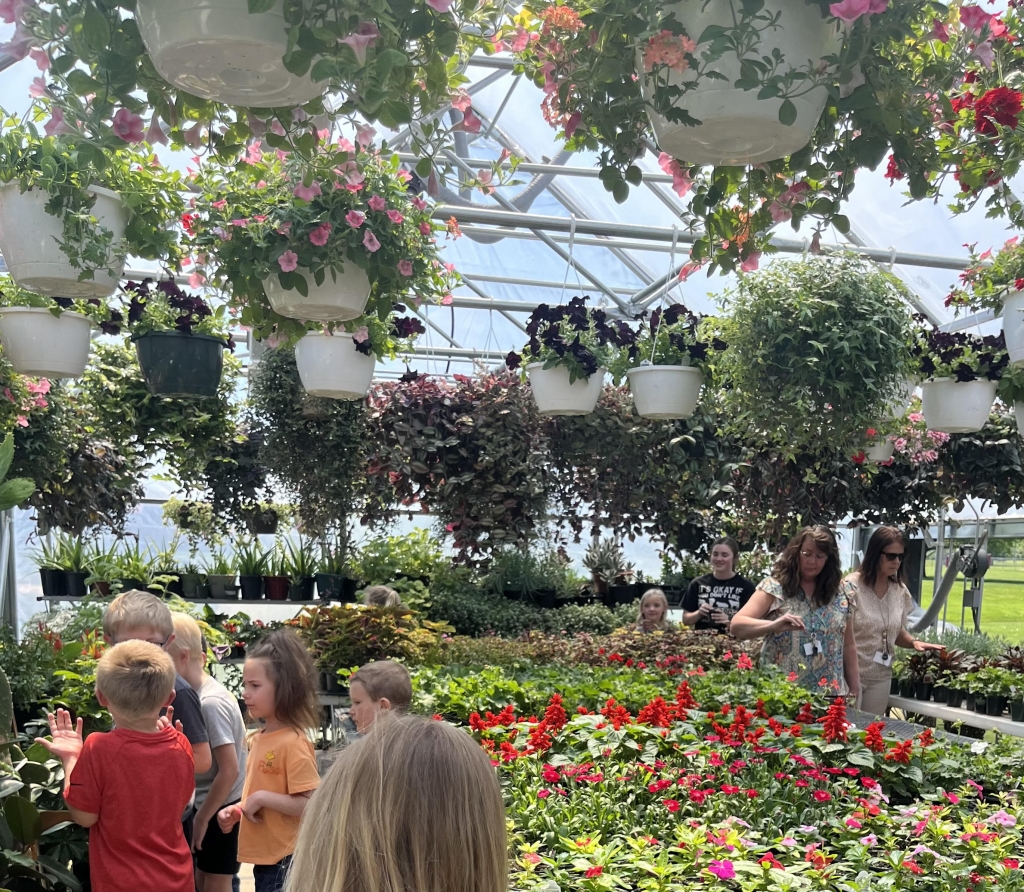 The North Clay FFA greenhouse being displayed to elementary students.