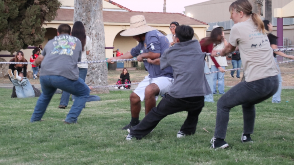 Students compete in an intense game of tug of war.