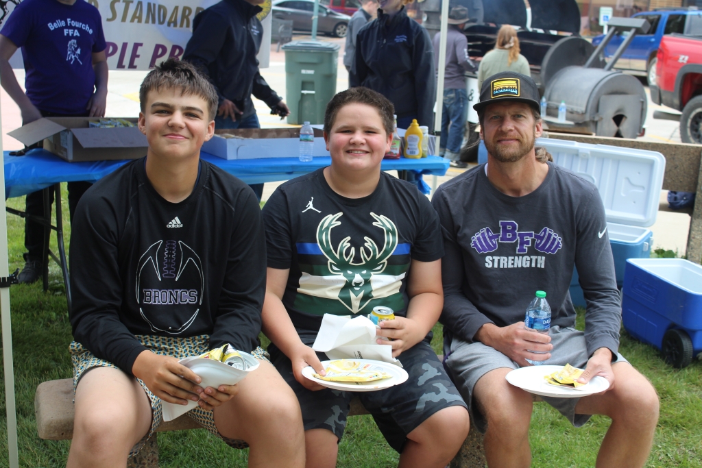 Gabe, Ben and Matthew Raba enjoy their burgers at 2023 Burger Bash.