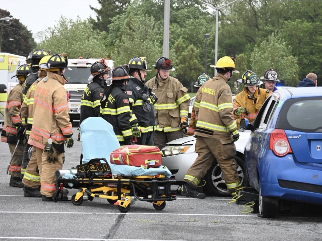 Junior firefighters work to quickly extract victims from the car during the staged demonstration.