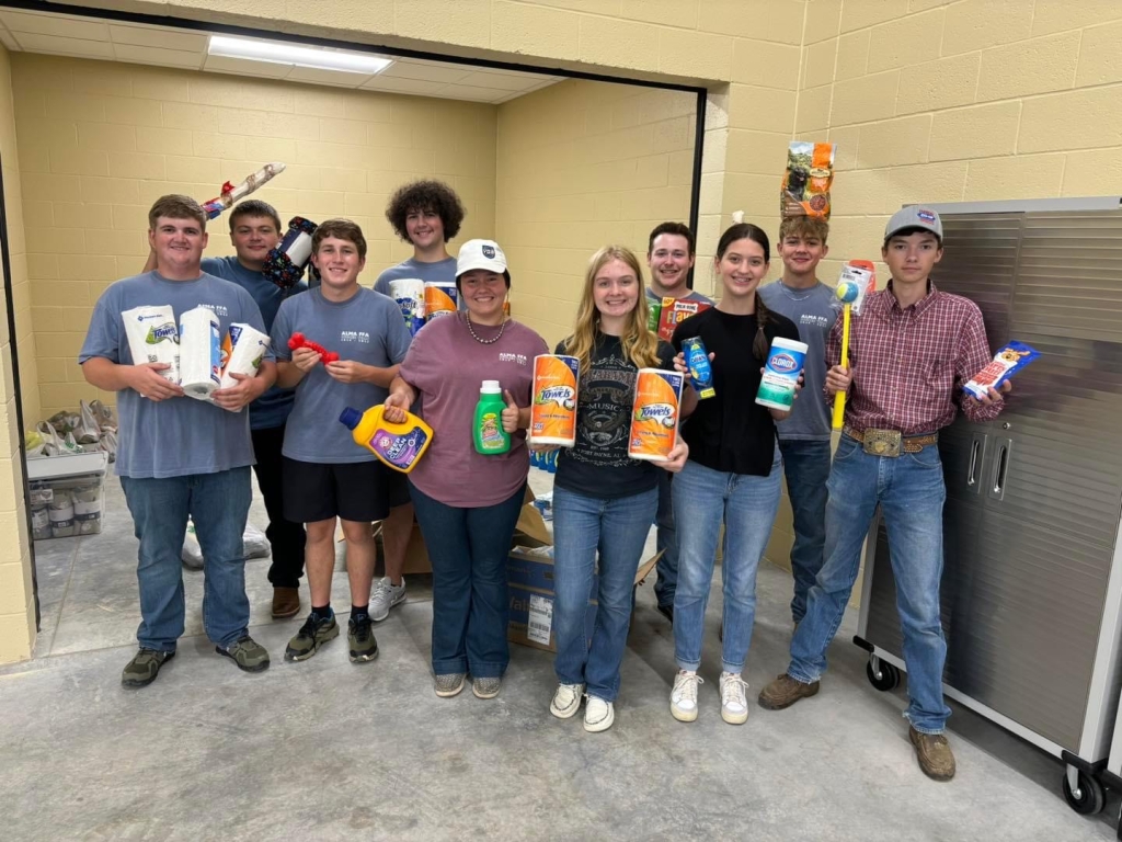 Part of Alma’s FFA chapter working to win the Battle of the Bone: FFA Edition. From left to right: Tucker Overby, Locklan Flanagan, Brody Taylor, Mason Collins, Ellie Johnson, Brittany Bowlin, Grayson Hopper, Logan Flanagan and Dakota Williams.