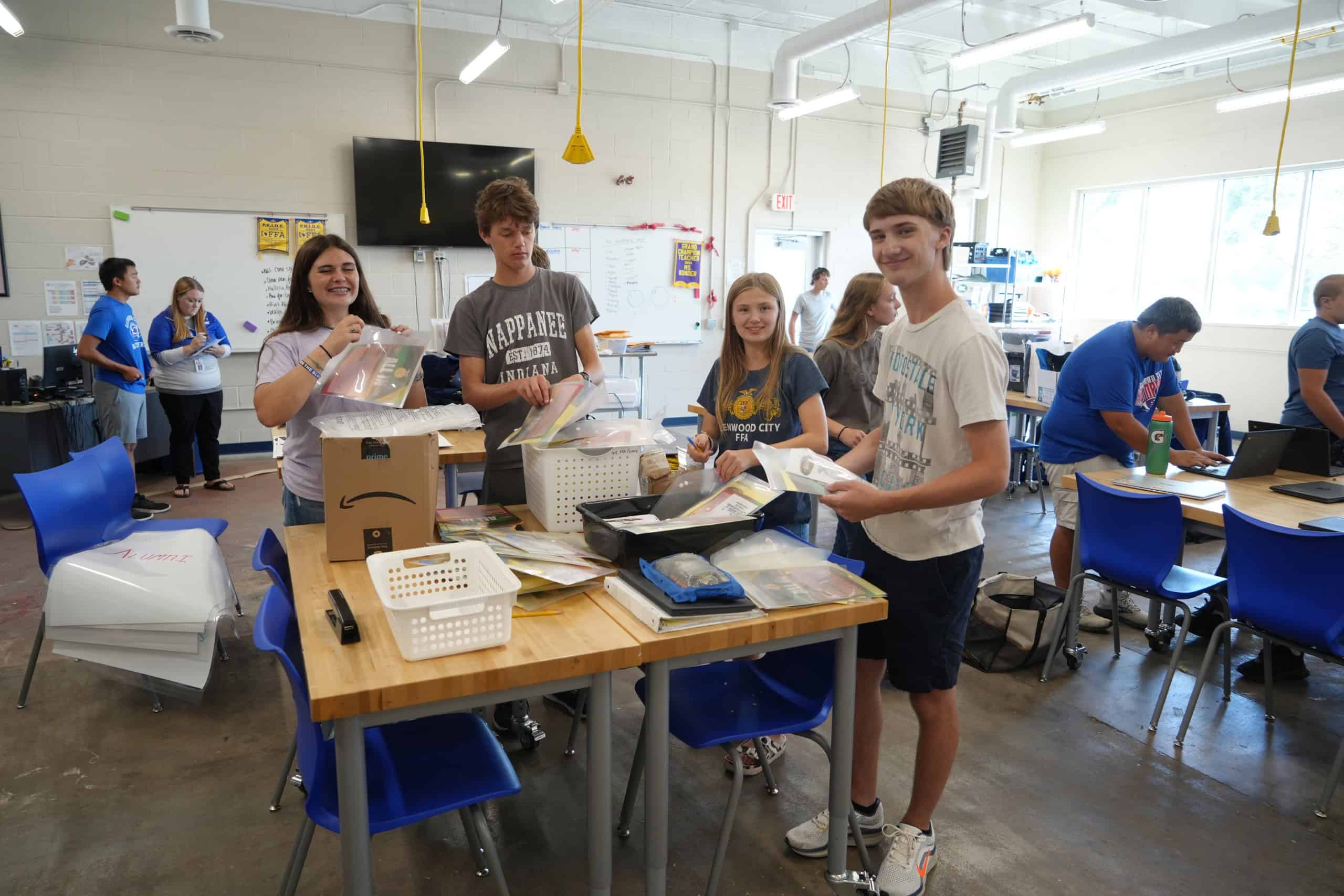 Glenwood City FFA members putting together program books before the Wisconsin Section 2 Fall Leadership Workshop.