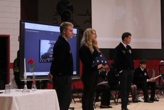 East Clinton FFA members demonstrate how to fold the American flag.