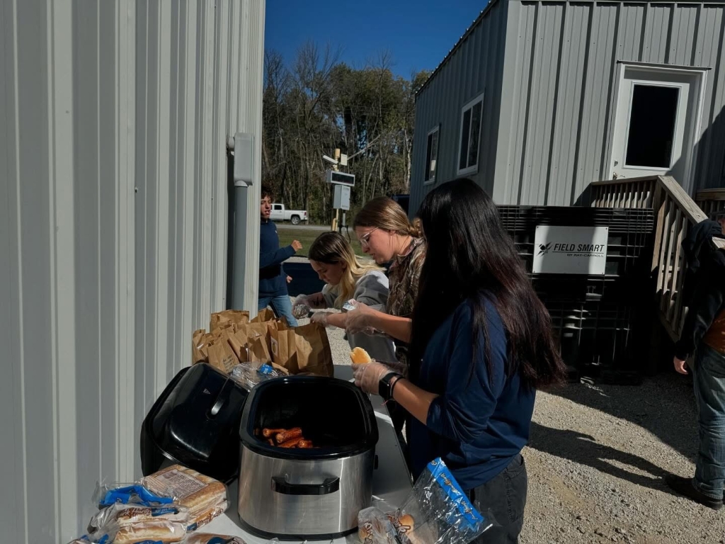 Brunswick FFA members prepare hotdogs, drinks and a dessert item for farmers and truckers at Feed-A-Farmer.