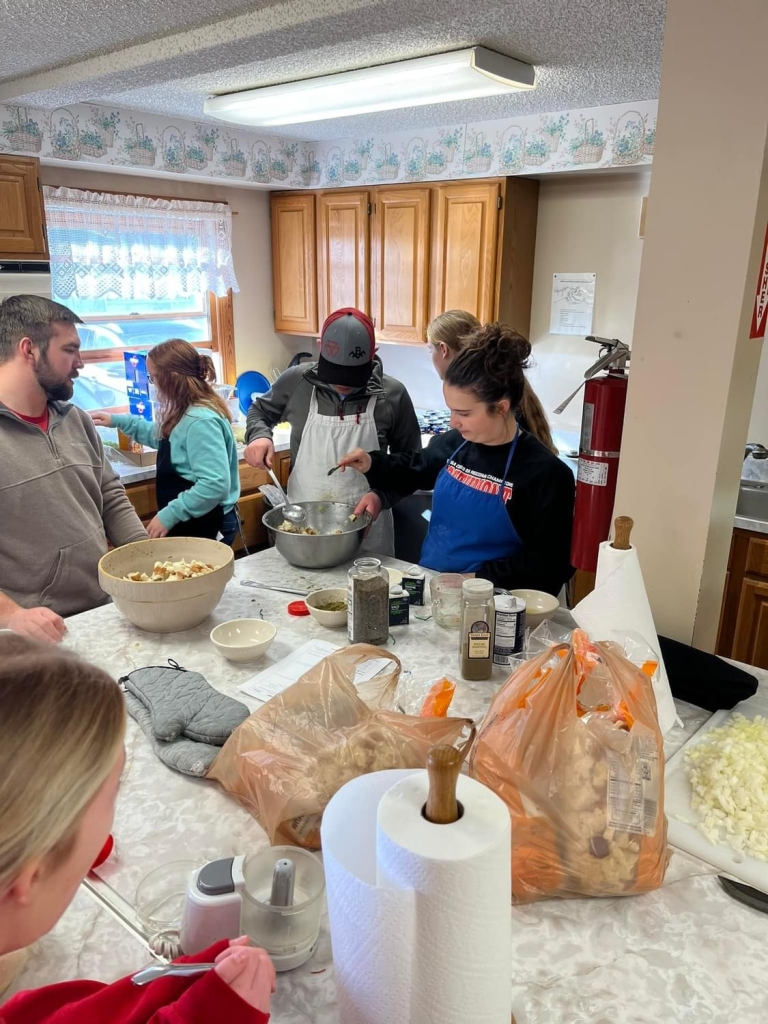 Southmont FFA members prepare food to serve.