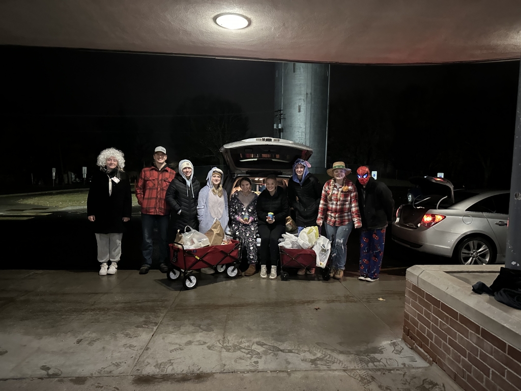 Neillsville FFA members pose with collected canned goods after their trick or treating event.