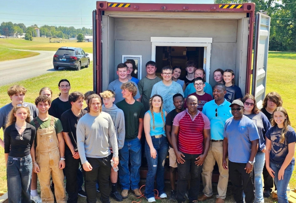 Members of the Madisonville North Hopkins FFA Chapter with the finished shipping container.