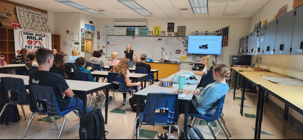 Firestone (front center) leads her classmates through a livestock judging unit. 