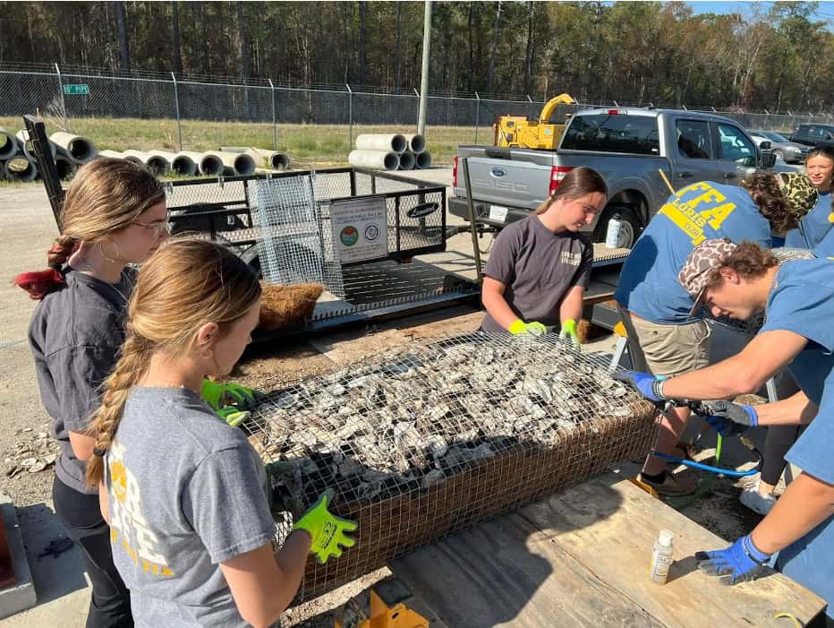 Loris FFA members working on the manufactured wire reefs.