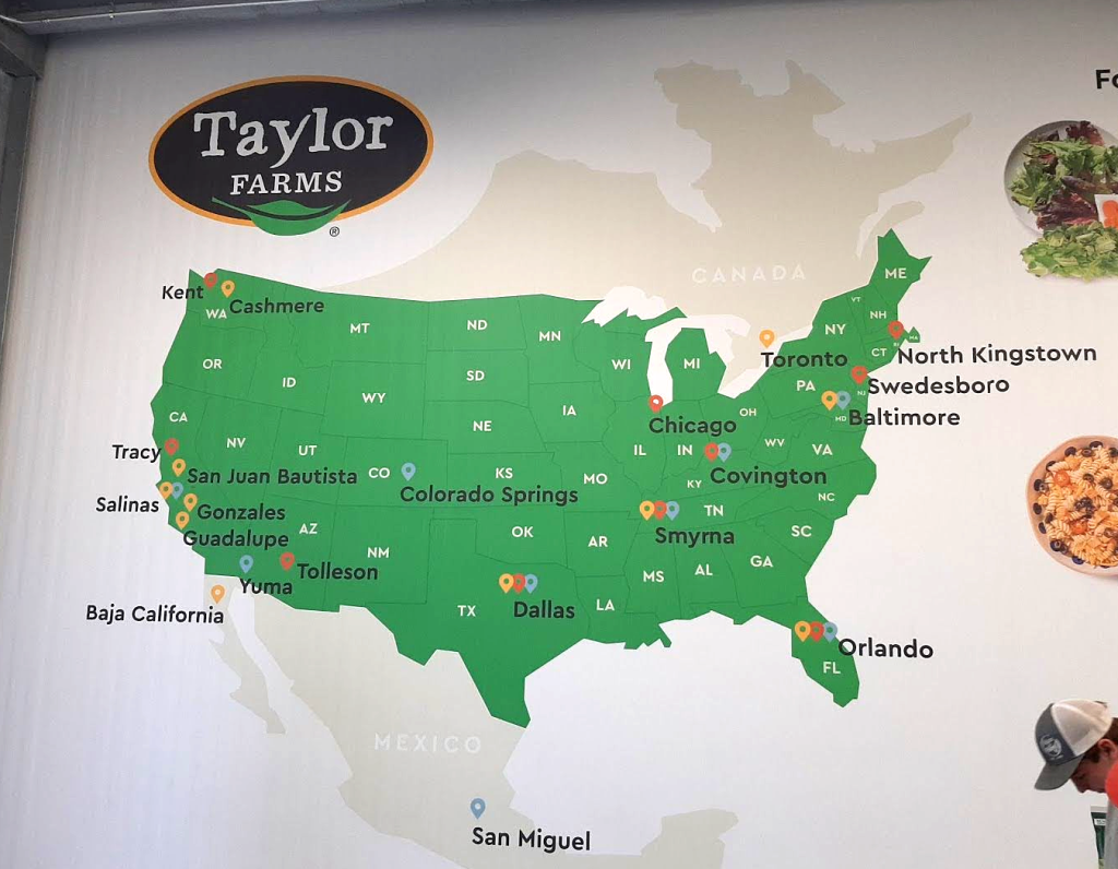 A map on the wall shows Taylor Farms locations across the U.S. and Mexico.