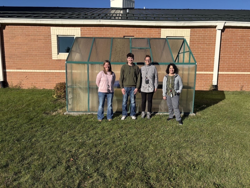 Cord Akey with teachers and the principal of Country Meadow Elementary.