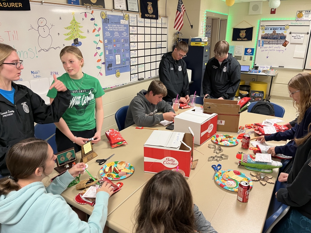 Members of the DeWitt Central FFA chapter construct Christmas cookie kits during their November meeting.