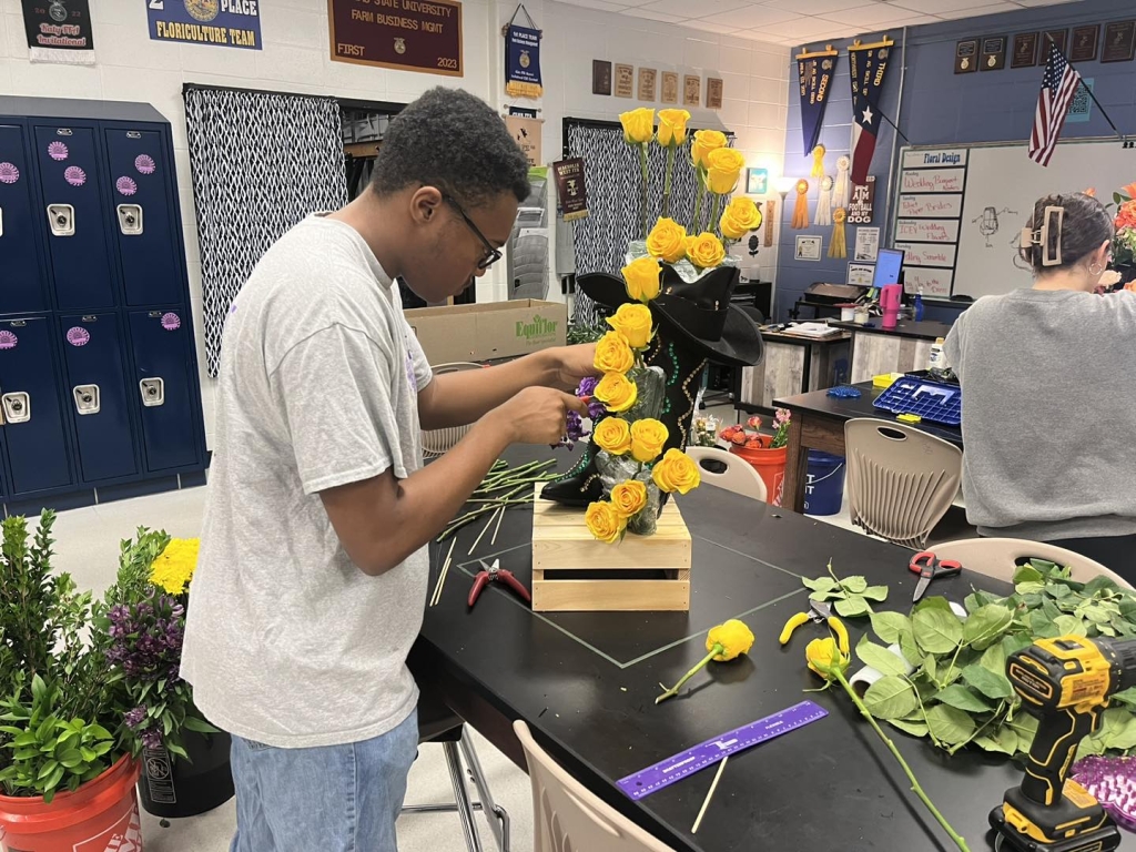 A James E. Taylor FFA member creates a design in class.