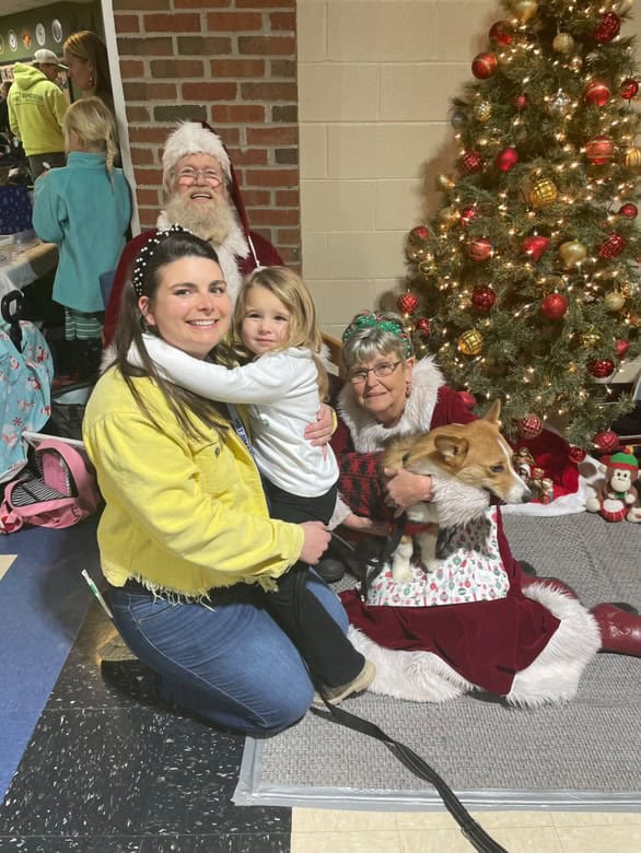 Farm toy show attendees visit with Santa.