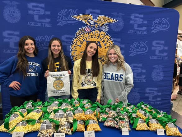 Spencer County FFA members hand out popcorn at the farmer appreciation booth.