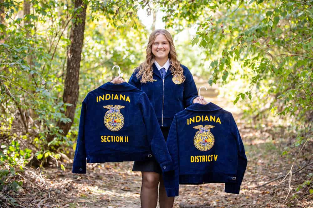 Katilyn Maruszewski poses with her chapter, district and section FFA jackets.