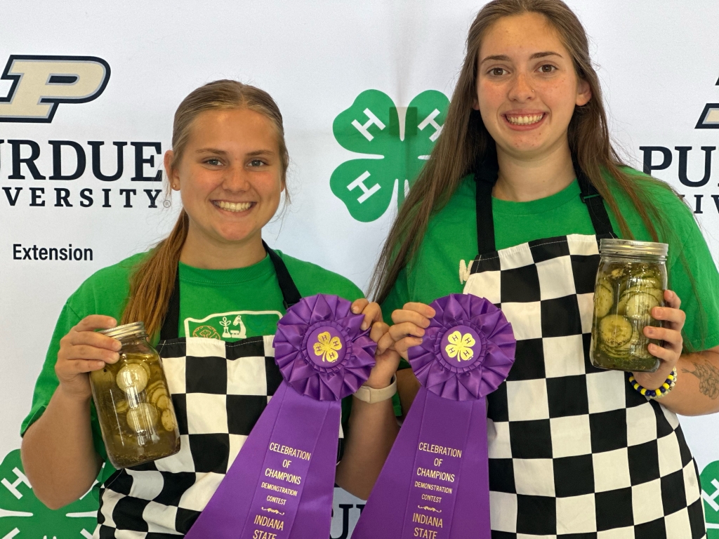 Maruszewski (left) and her partner are recognized for their 4-H demonstration at the Indiana State Fair.