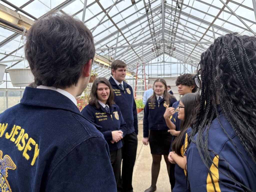 The 2024-25 New Jersey FFA state officers mingle with Middlesex-Piscataway FFA members.