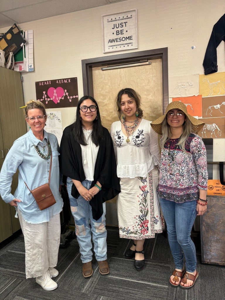 Advisor Mrs. Sawyer (far left) and FFA members Nadia Kharoufeh (left center), Abril Negrete (right center) and Jaimil Martinez (far right) dress up during their school’s National FFA Week spirit days.