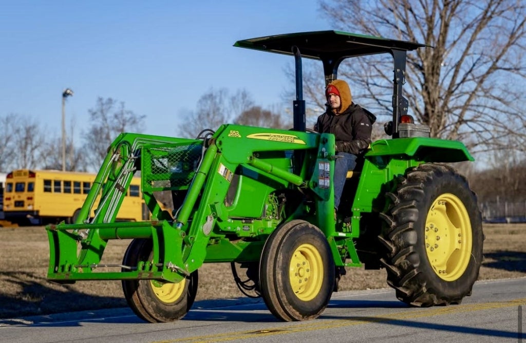 Thurman Floyd showcases his tractor on Drive Your Tractor to School Day at West Rowan High School.