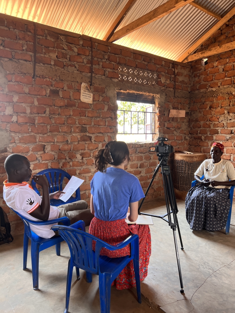 Mathis (center) interviews a Ugandan woman for her honor’s thesis project. Photo courtesy of Anna Mathis.