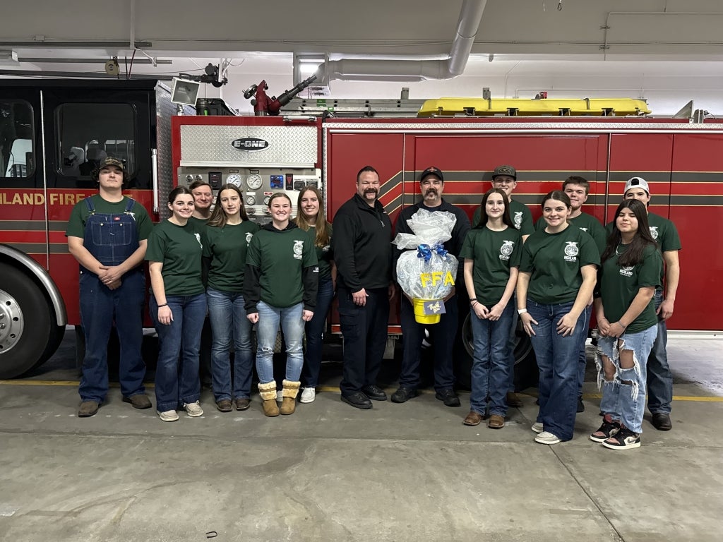 Richland FFA members deliver a first responder basket to firefighters at the Richland Fire Department.