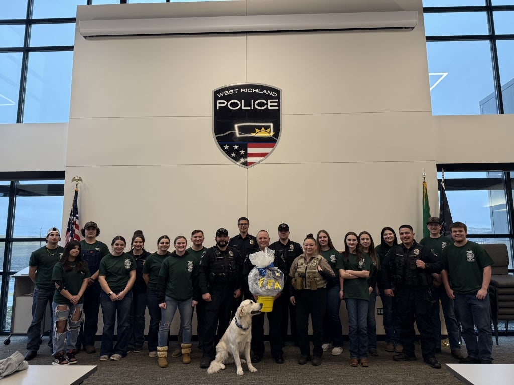 Richland FFA members pose with officers from the West-Richland Police Department.