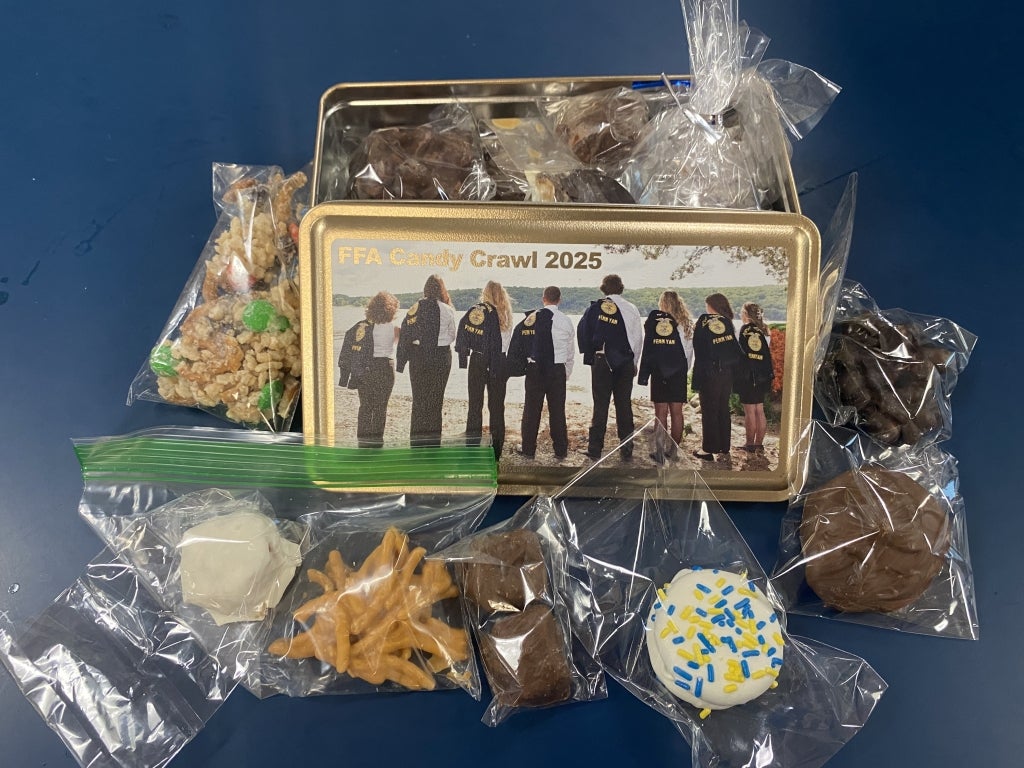 Tins provided for the event featured a photo of the current Penn Yan FFA officer team.