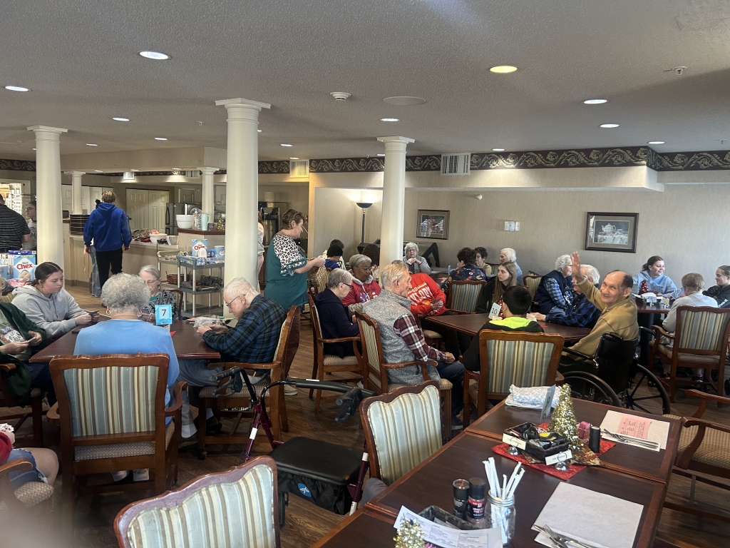 Lebanon FFA members play card games with Crown Pointe residents.